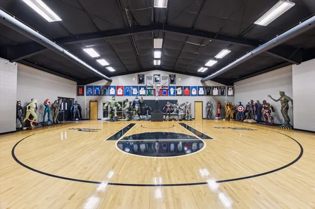 a room with gym equipment and a table
