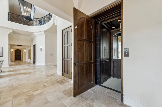 a view of a hallway with paintings on the walls