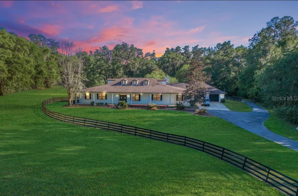 1110 Southeast 82nd Street Road Ocala, FL 34480 - Photo 1 of 1 Front elevation at Twilight