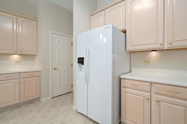 a white refrigerator freezer sitting inside of a kitchen