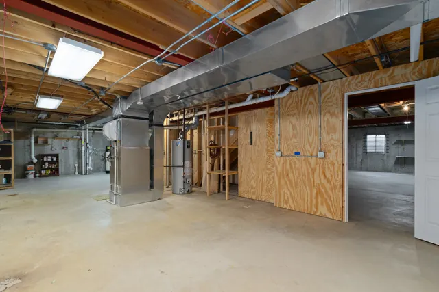 a view of empty room with wooden walls