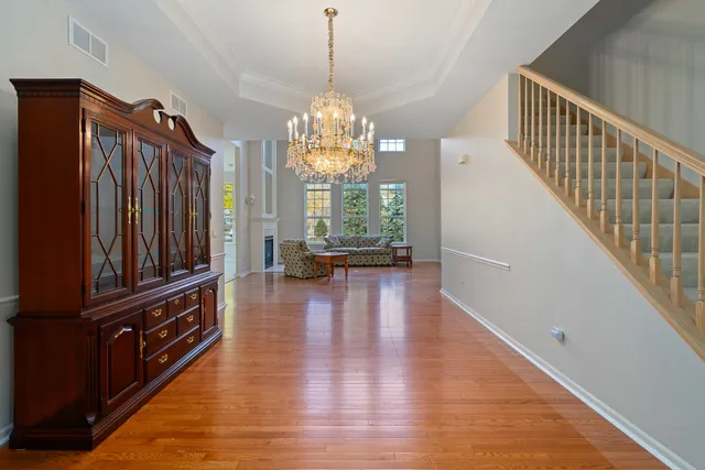 a view of a furniture wooden floor windows and entryway
