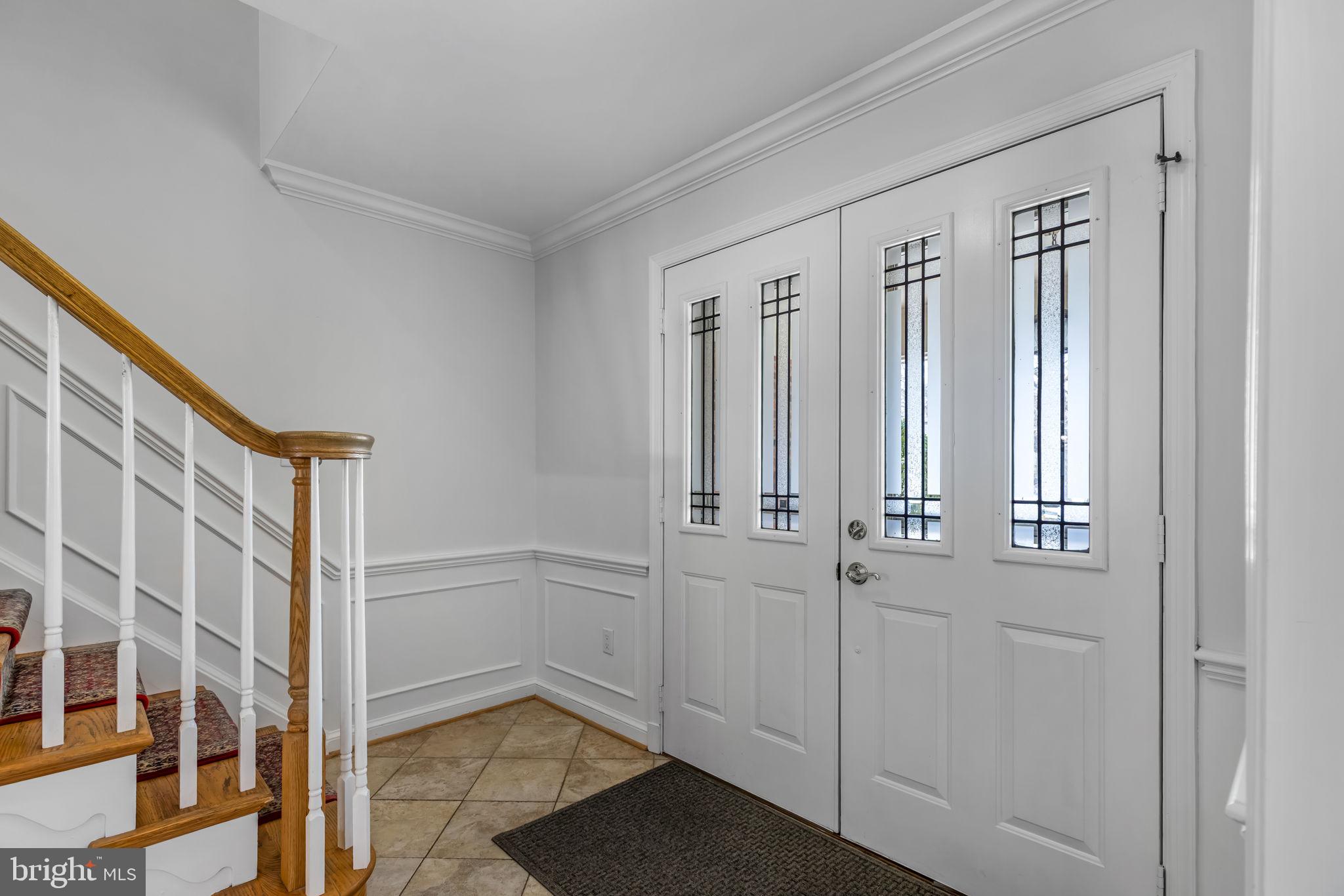 7105 Devonshire Road Alexandria, VA 22307 - Photo 12 of 54 Light-filled foyer with double door