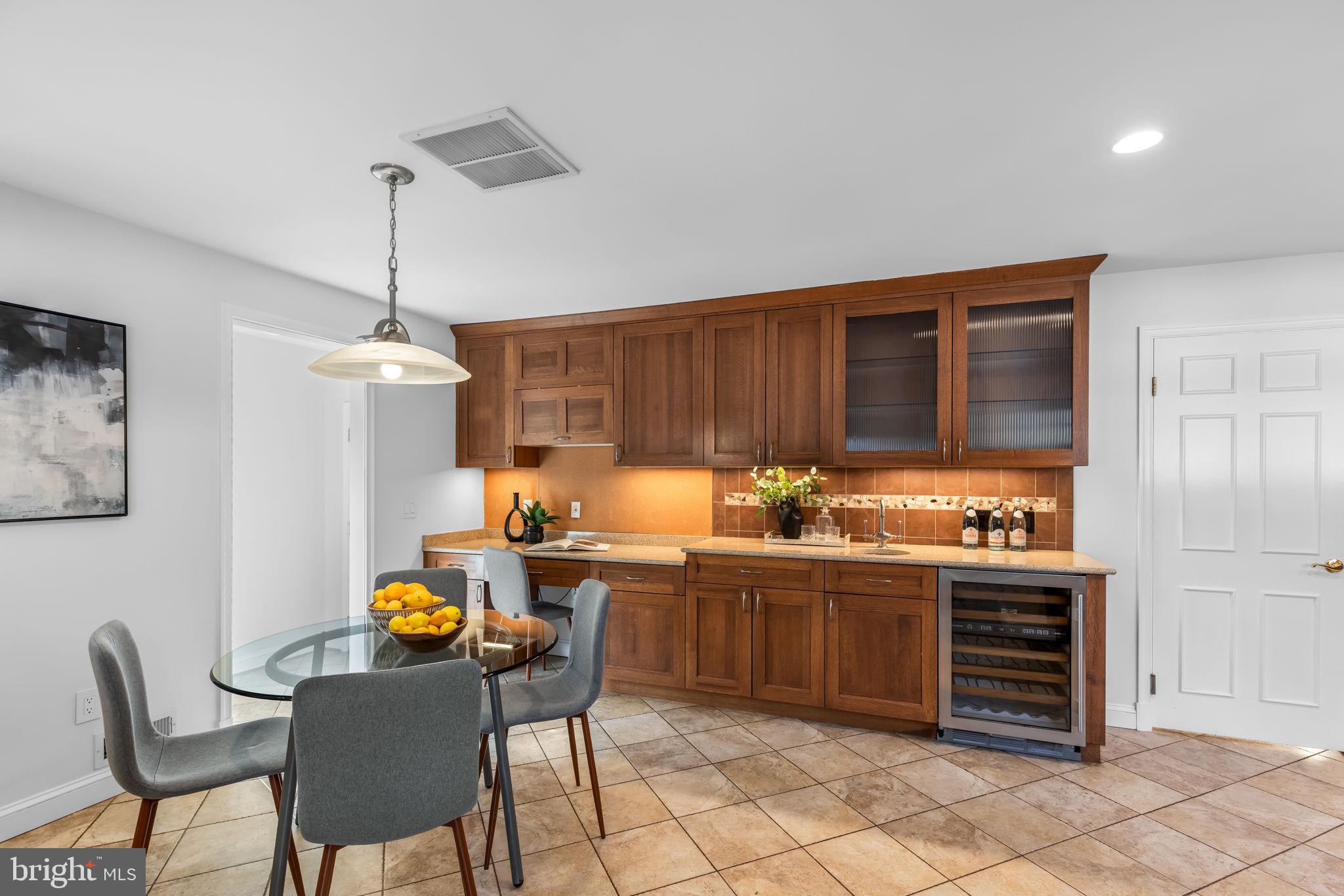 7105 Devonshire Road Alexandria, VA 22307 - Photo 5 of 54 Breakfast nook w wine fridge & built-ins