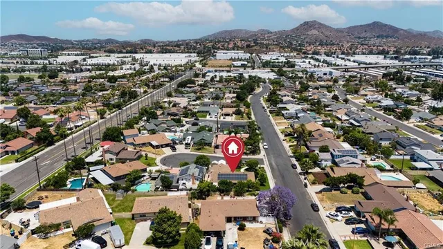 an aerial view of residential houses with outdoor space