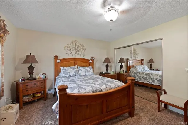 a bed room with furniture and a chandelier