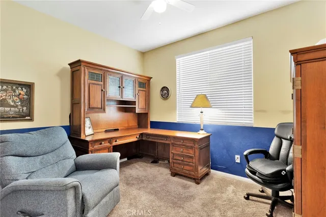 a view of living room filled with furniture and a window