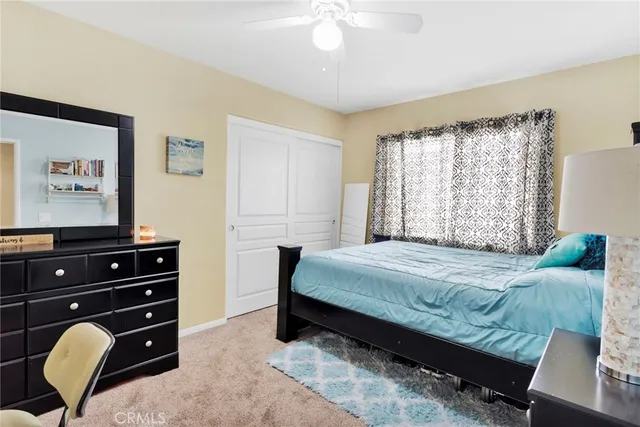 a view of a large building with a big yard and large trees