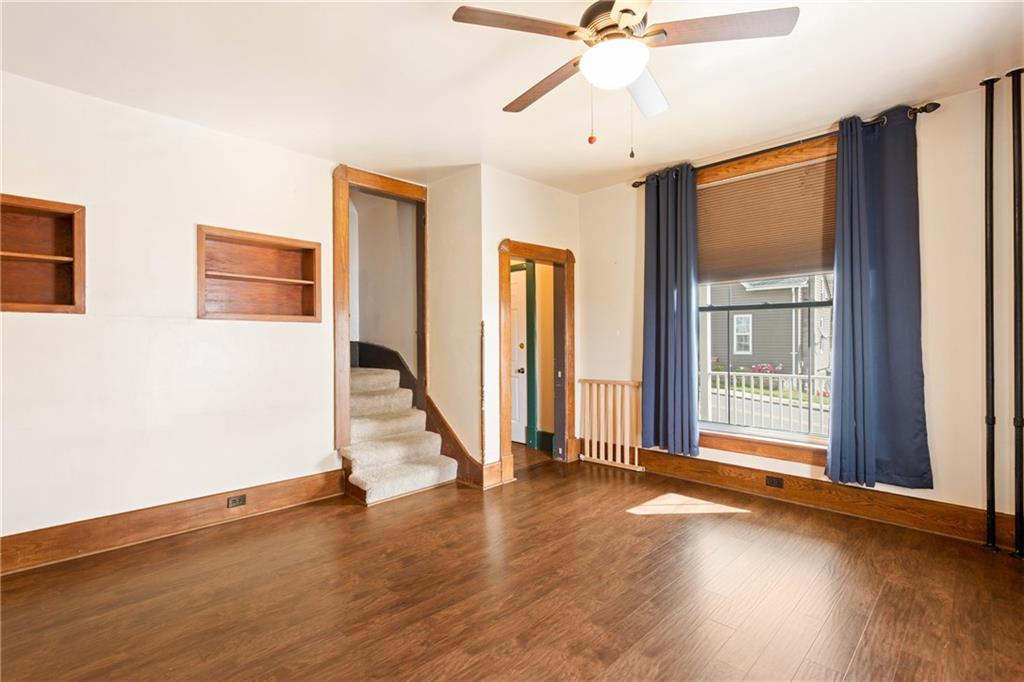 308 East Main Street Stoystown, PA 15563 - Photo 14 of 49 a view of a livingroom with wooden floor and a ceiling fan