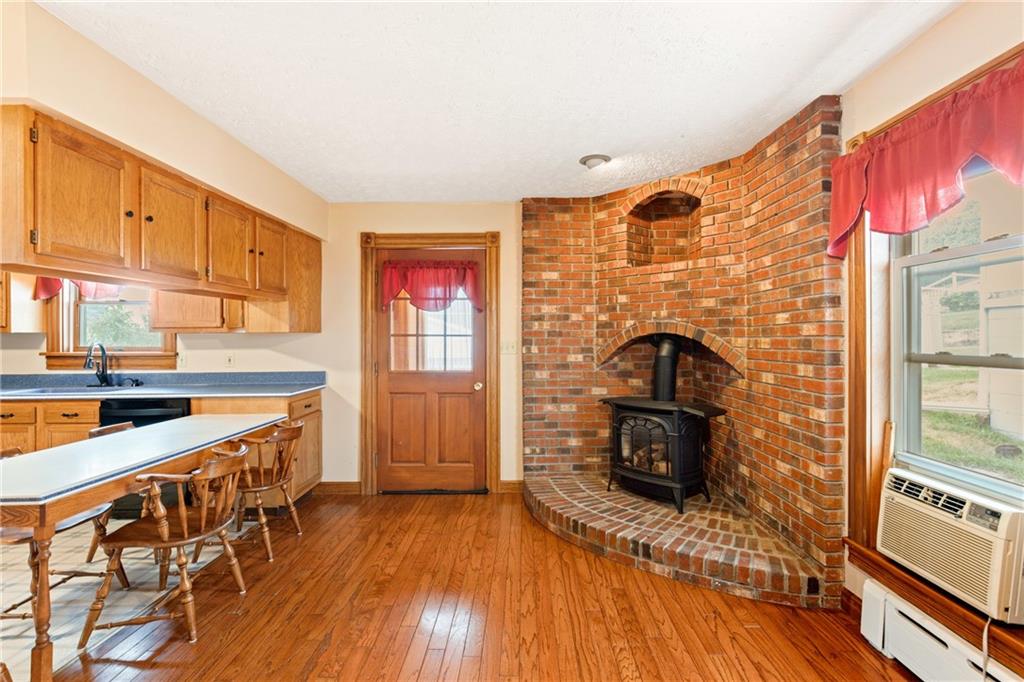 308 East Main Street Stoystown, PA 15563 - Photo 24 of 49 a kitchen with stainless steel appliances granite countertop a stove a sink and a refrigerator