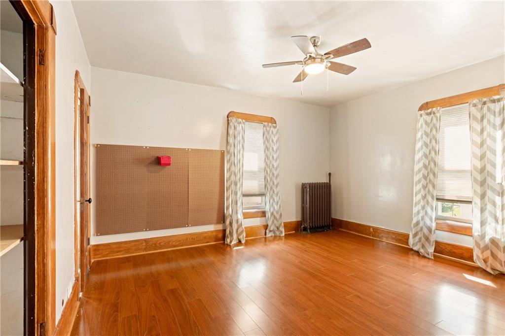308 East Main Street Stoystown, PA 15563 - Photo 32 of 49 wooden floor in an empty room with a window