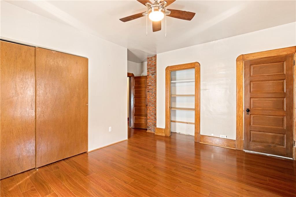 308 East Main Street Stoystown, PA 15563 - Photo 33 of 49 a view of an empty room with wooden floor and a window