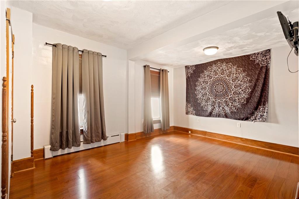 308 East Main Street Stoystown, PA 15563 - Photo 34 of 49 a view of an empty room with wooden floor and a window