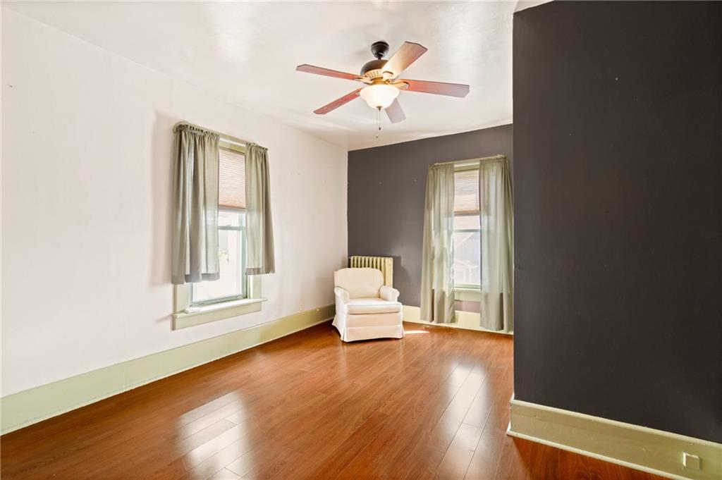 308 East Main Street Stoystown, PA 15563 - Photo 36 of 49 an empty room with wooden floor and windows