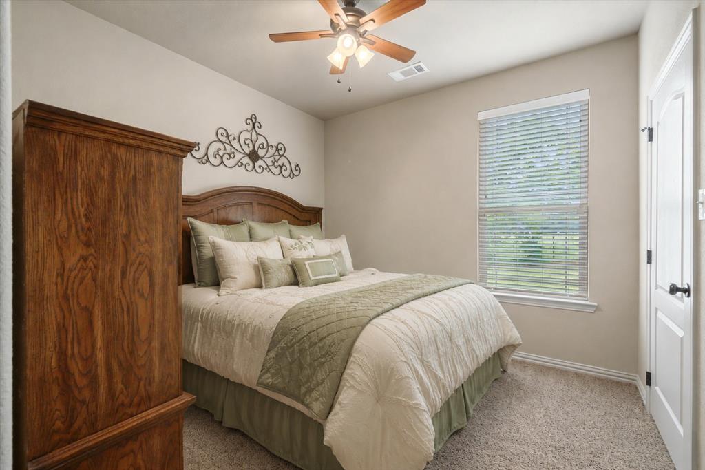 1852 Meadowview Canton, TX 75103 - Photo 21 of 28 a bedroom with a bed and window