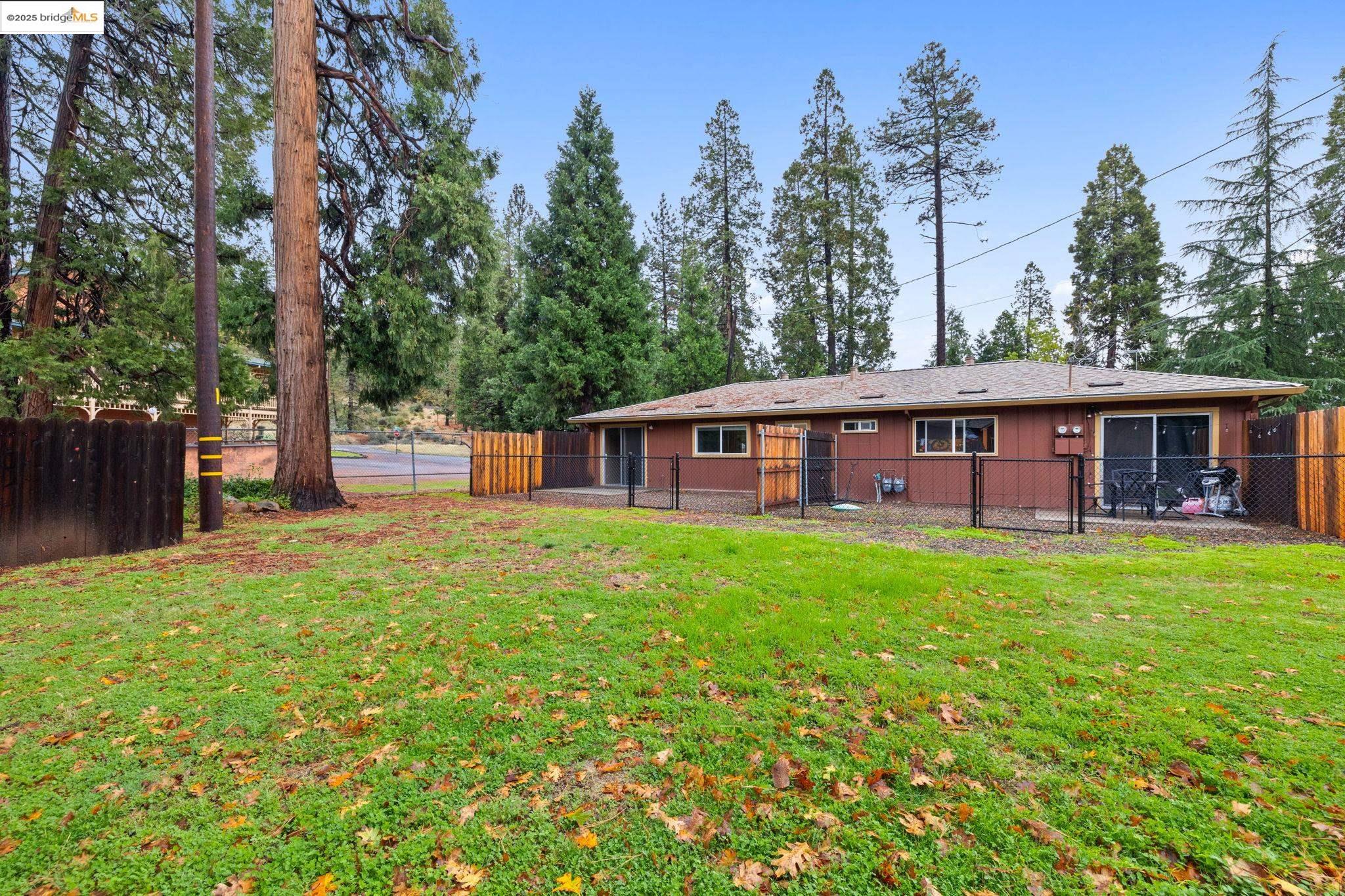 17943 Plateau Road Sonora, CA 95370 - Photo 3 of 11 Back of house with a fenced backyard