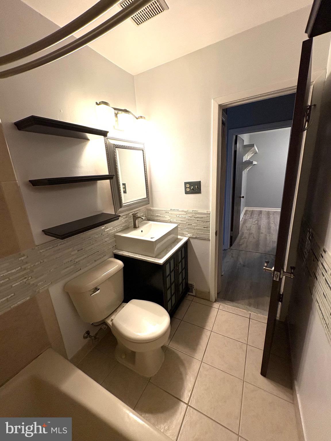 319 South Coles Avenue Maple Shade, NJ 08052 - Photo 15 of 23 a bathroom with a toilet a sink and mirror