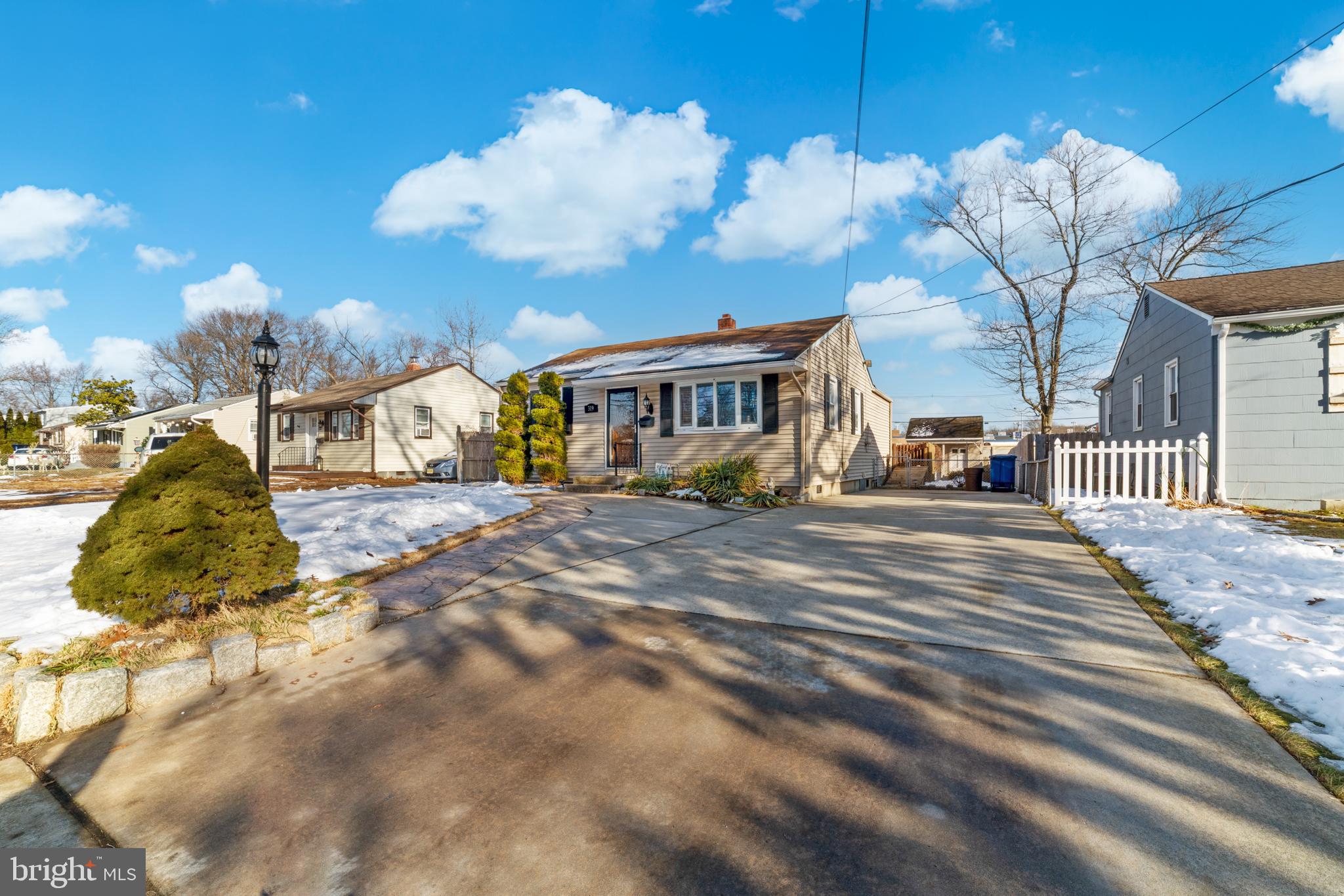 319 South Coles Avenue Maple Shade, NJ 08052 - Photo 2 of 23 a view of a house with snow on the road