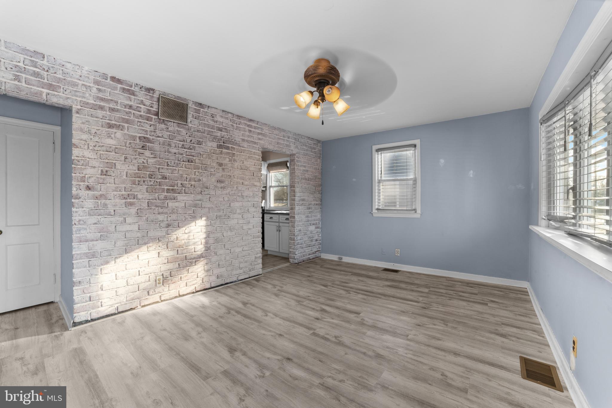 319 South Coles Avenue Maple Shade, NJ 08052 - Photo 5 of 23 wooden floor in an empty room with a window