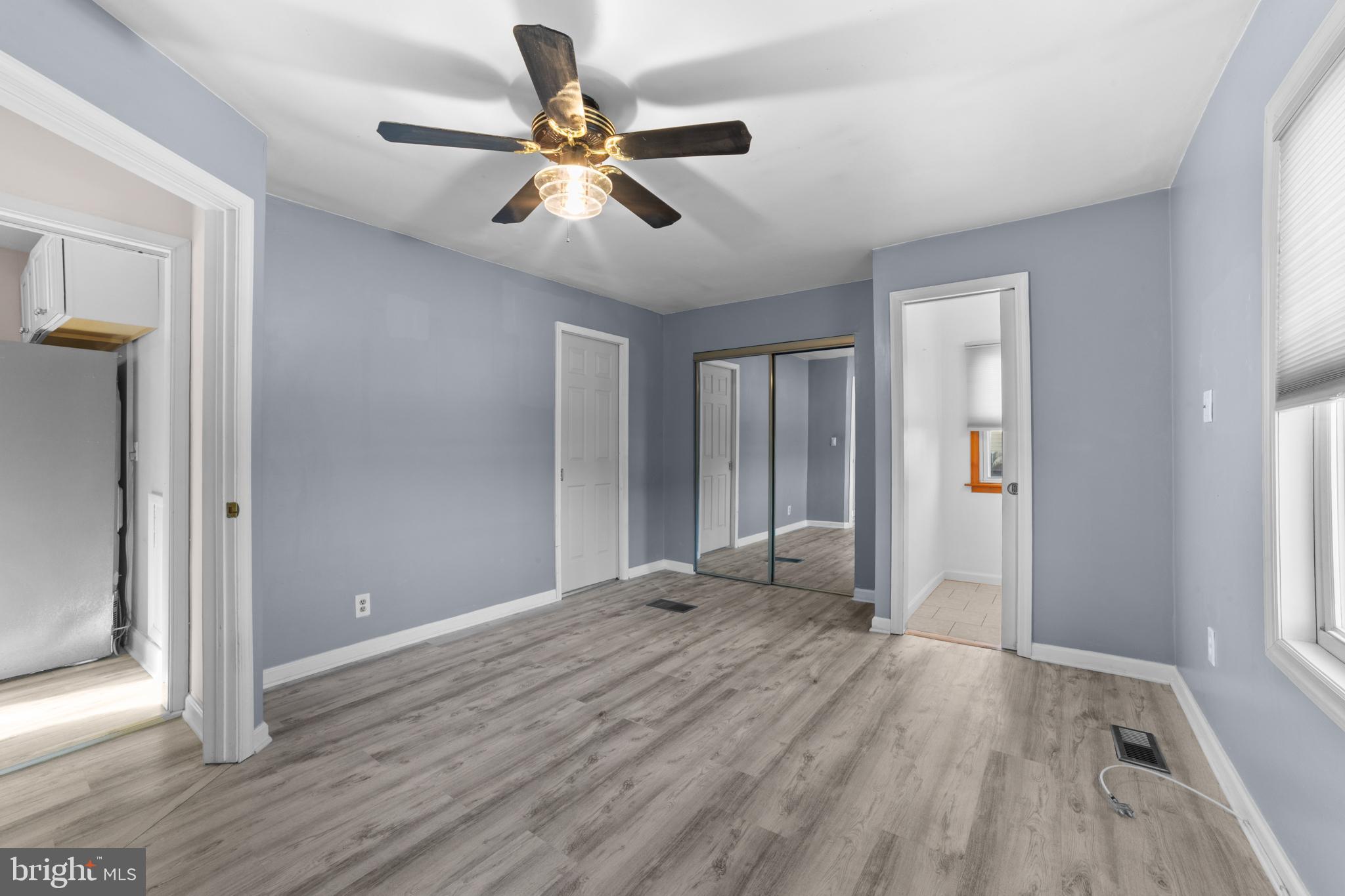 319 South Coles Avenue Maple Shade, NJ 08052 - Photo 9 of 23 wooden floor in an empty room with a window