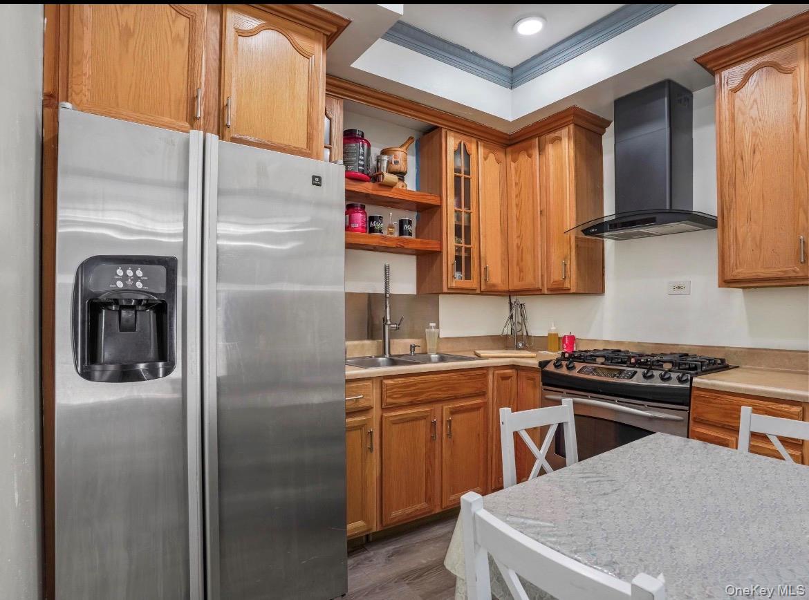 104-55 39th Avenue Queens, NY 11368 - Photo 3 of 14 a kitchen with stainless steel appliances granite countertop a refrigerator and a stove