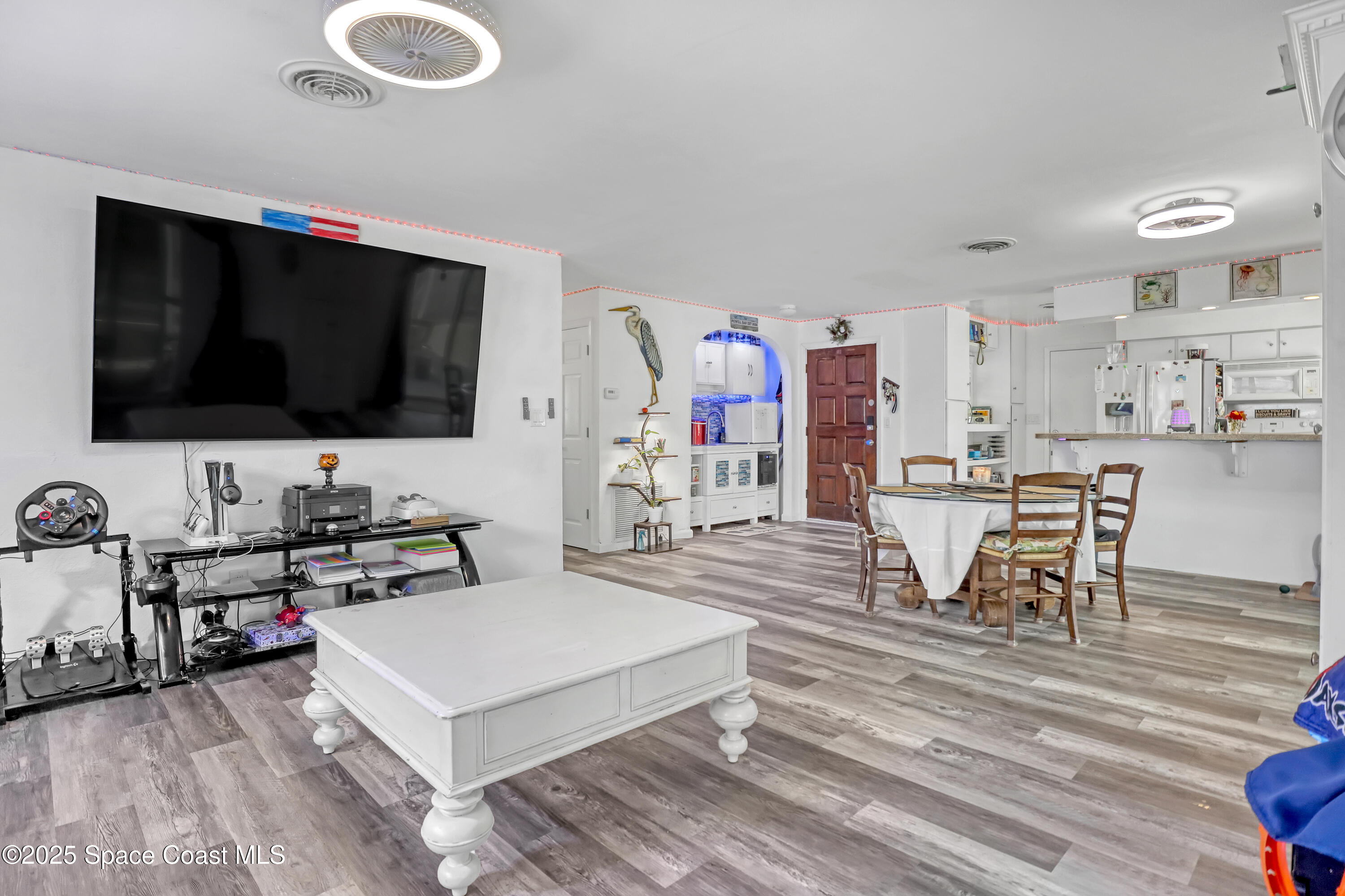 355 Aztec Avenue Merritt Island, FL 32952 - Photo 11 of 48 a living room with furniture and a flat screen tv