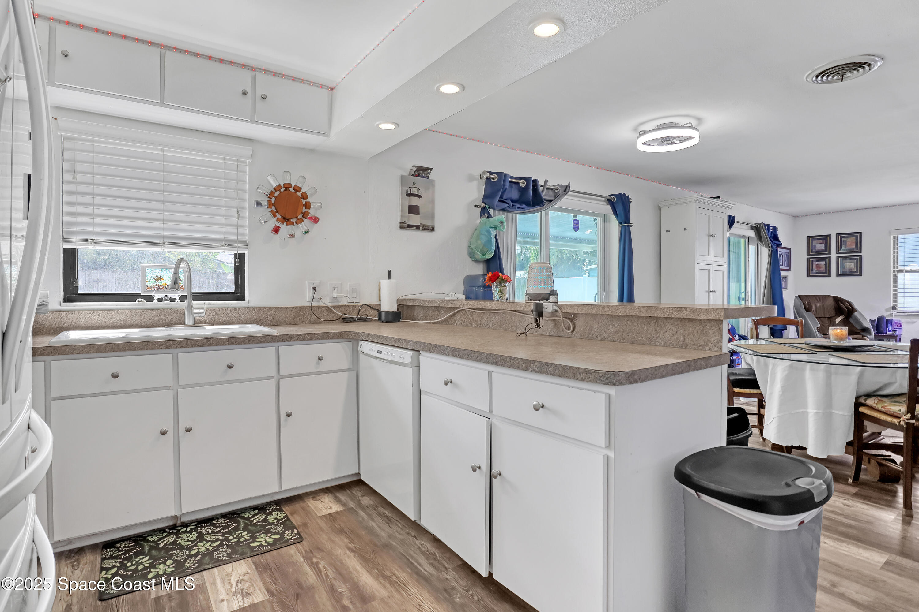 355 Aztec Avenue Merritt Island, FL 32952 - Photo 14 of 48 a bathroom with a granite countertop sink and a mirror
