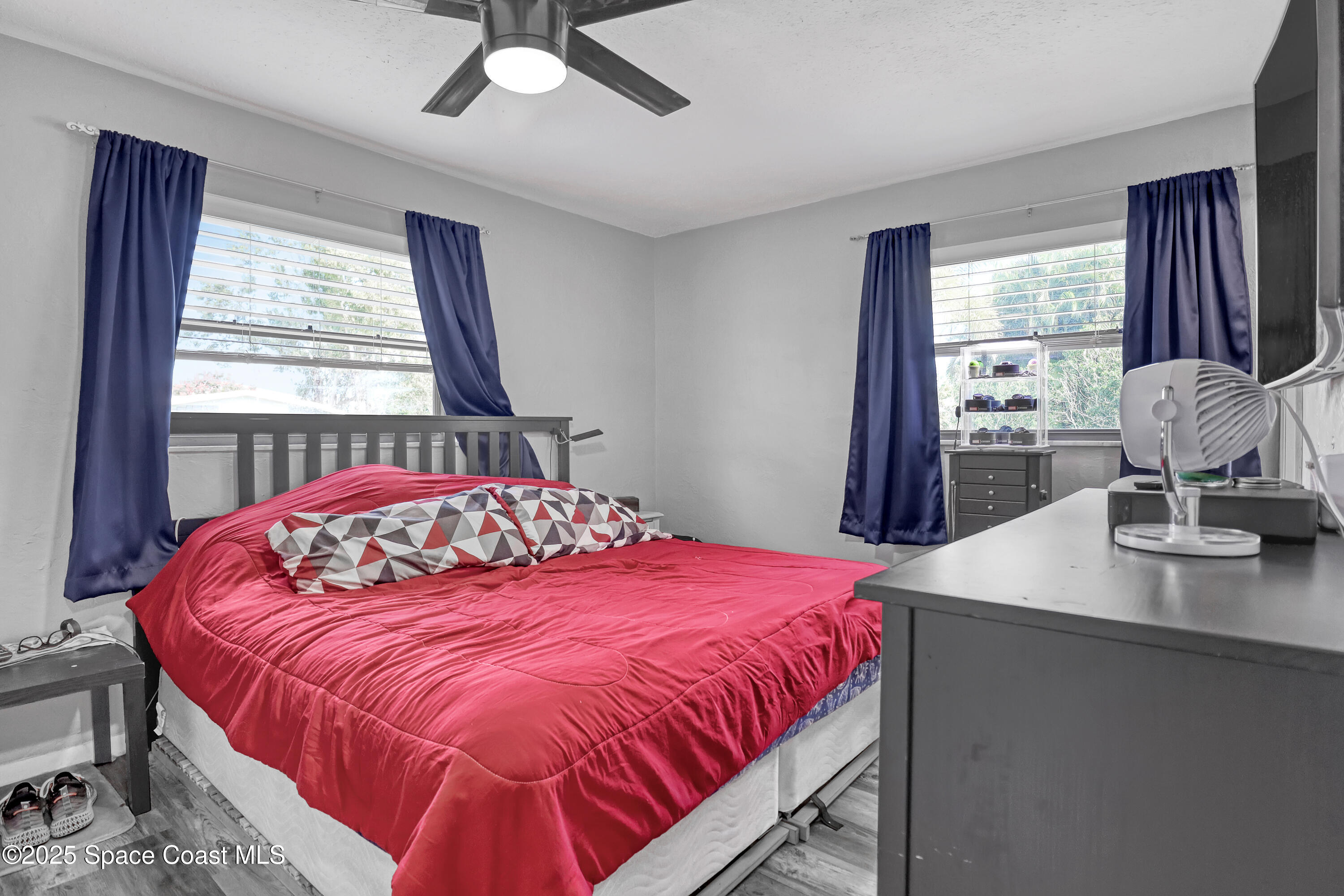 355 Aztec Avenue Merritt Island, FL 32952 - Photo 17 of 48 a bedroom with a bed and window