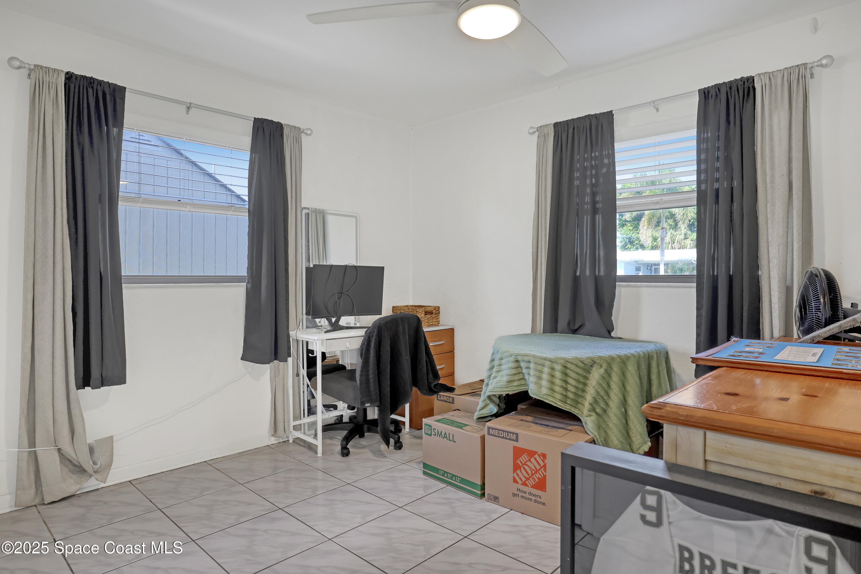 355 Aztec Avenue Merritt Island, FL 32952 - Photo 20 of 48 a bedroom with furniture and a window