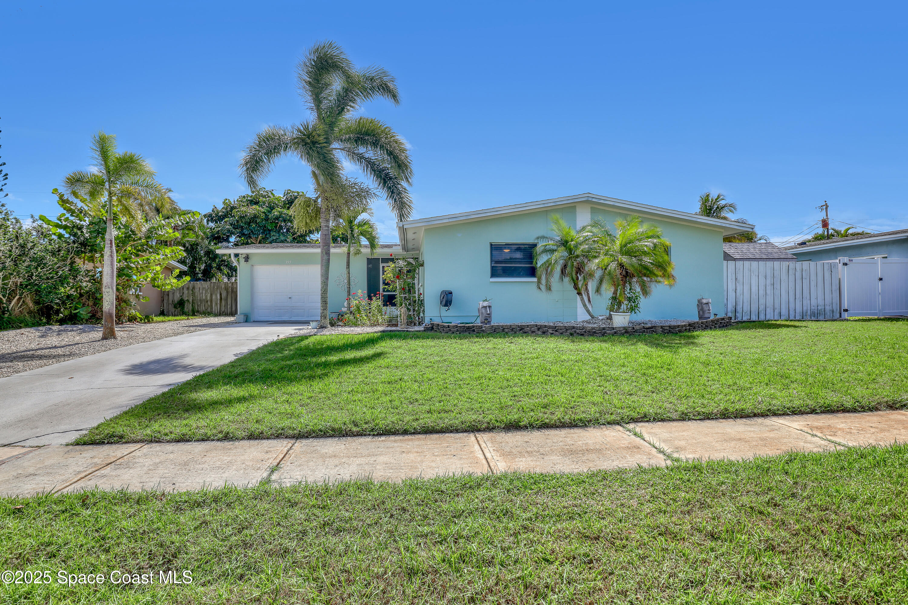 355 Aztec Avenue Merritt Island, FL 32952 - Photo 2 of 48 a view of a house with a yard