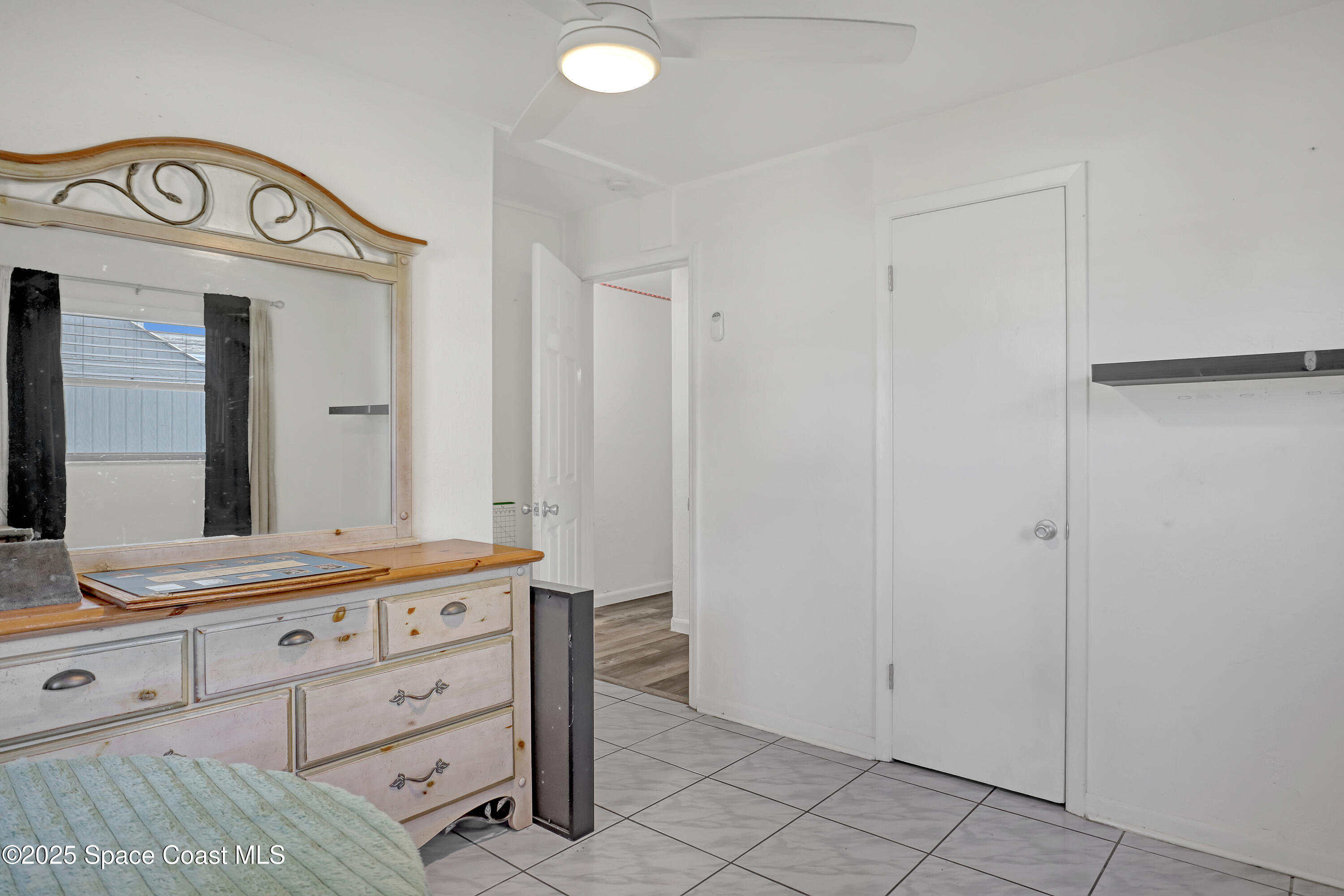 355 Aztec Avenue Merritt Island, FL 32952 - Photo 21 of 48 a bathroom with a sink a vanity and a mirror