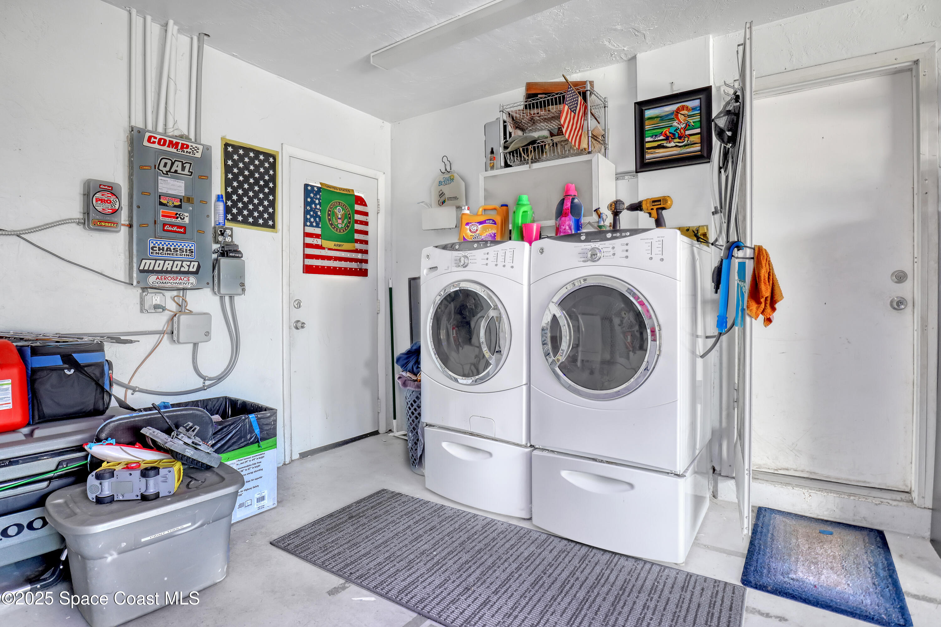 355 Aztec Avenue Merritt Island, FL 32952 - Photo 27 of 48 a storage room with washer and dryer