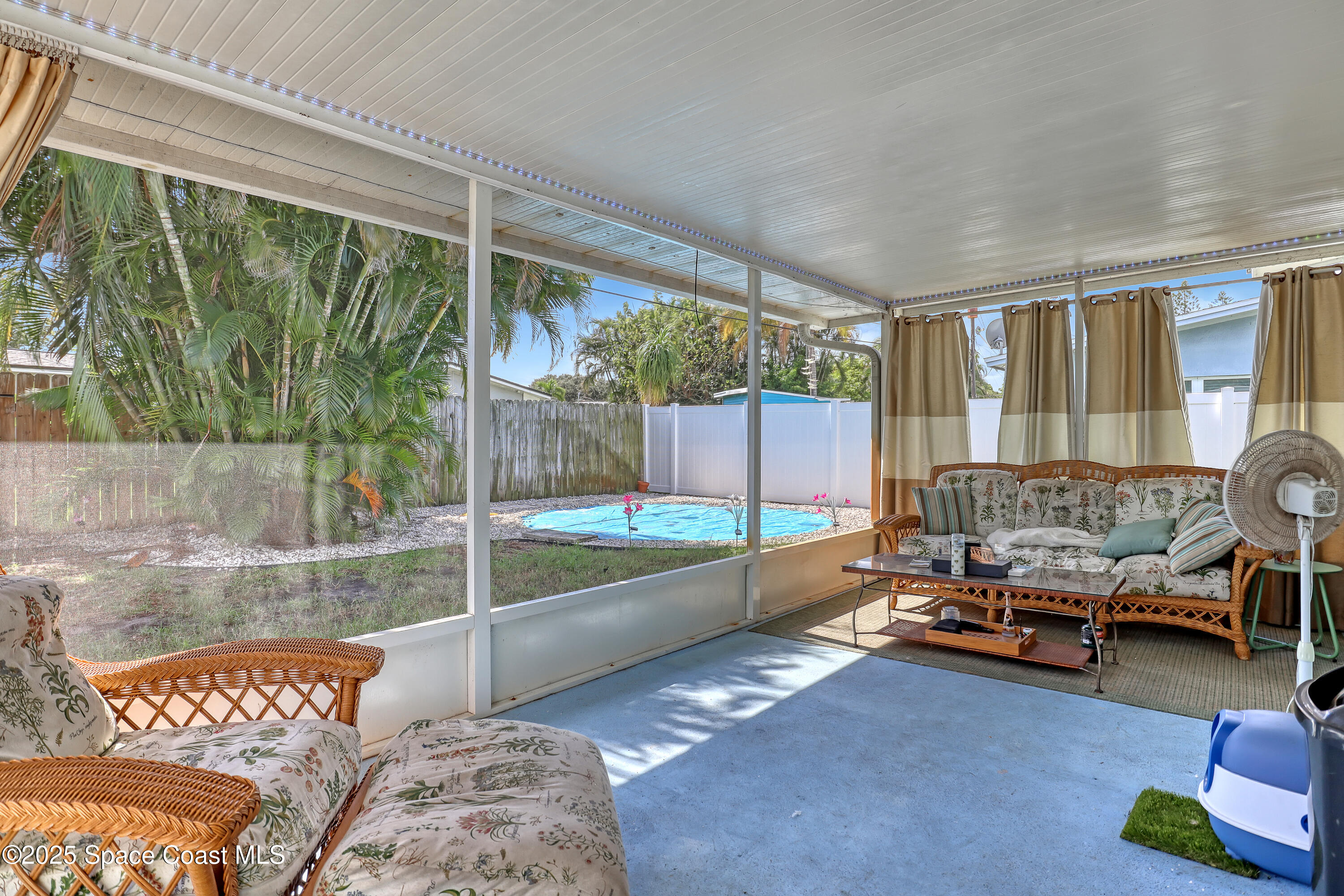355 Aztec Avenue Merritt Island, FL 32952 - Photo 28 of 48 a living room with couch and a table