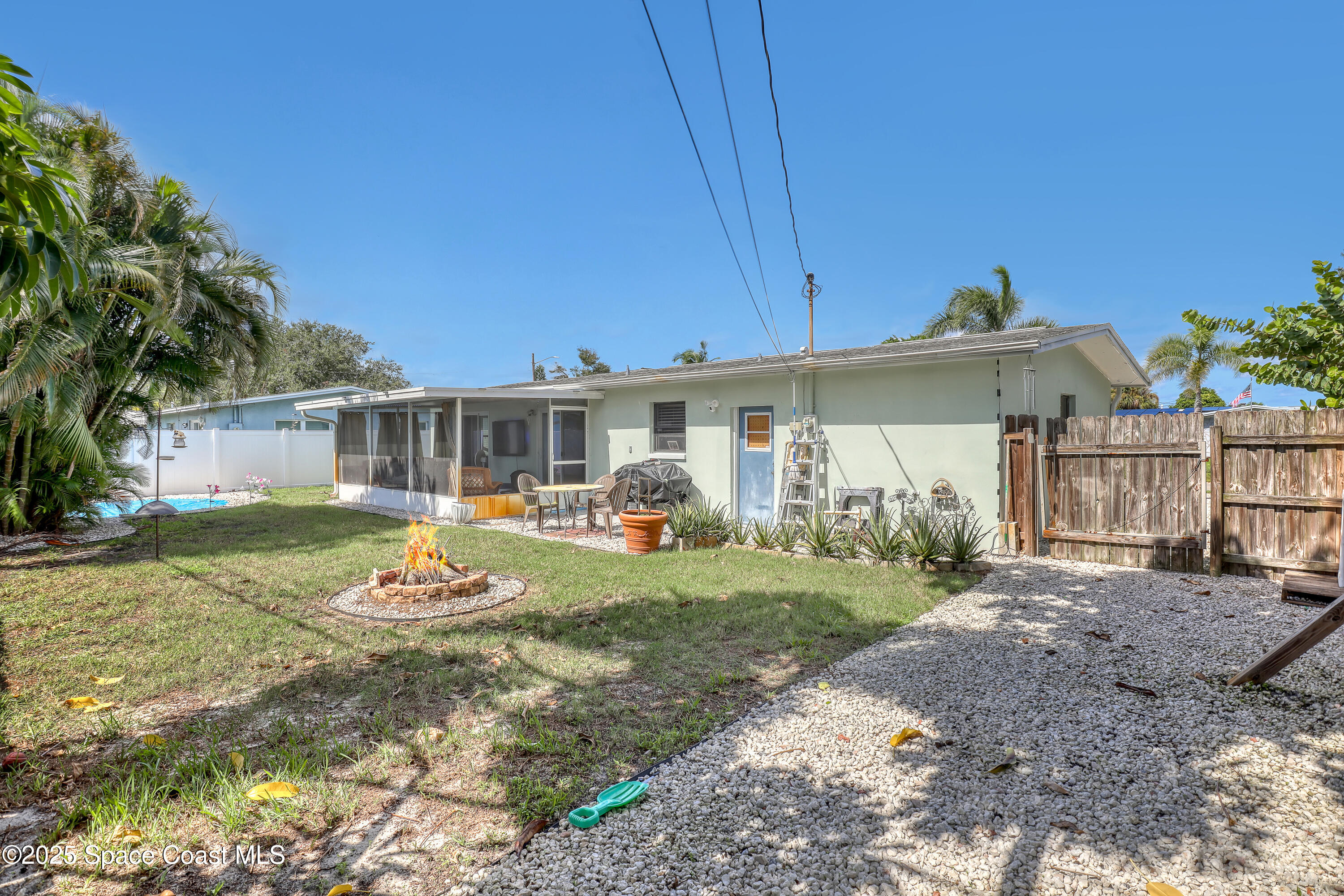 355 Aztec Avenue Merritt Island, FL 32952 - Photo 32 of 48 a front view of a house with garden