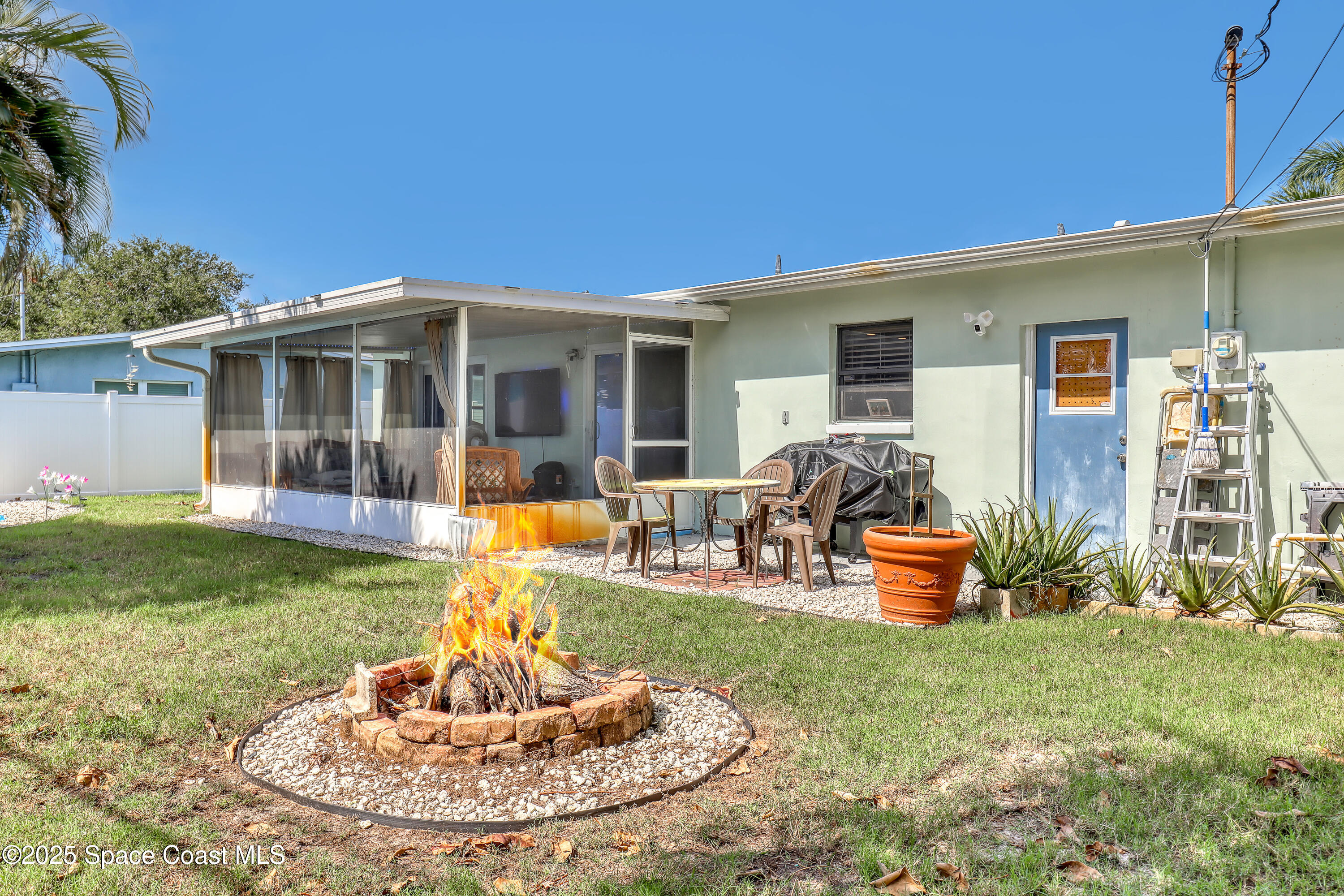 355 Aztec Avenue Merritt Island, FL 32952 - Photo 35 of 48 a front view of a house with patio