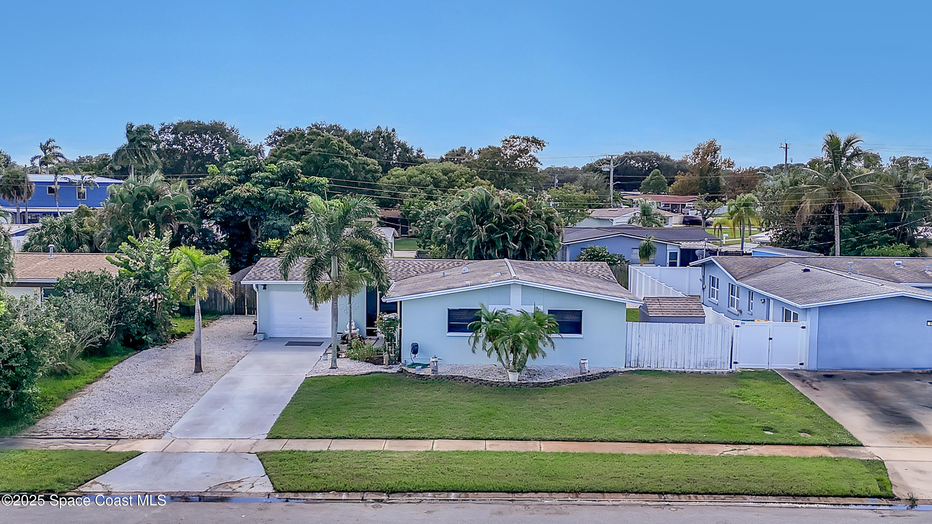 355 Aztec Avenue Merritt Island, FL 32952 - Photo 38 of 48 a view of a house with a garden