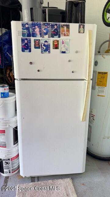 355 Aztec Avenue Merritt Island, FL 32952 - Photo 48 of 48 a white refrigerator with white walls and view of kitchen