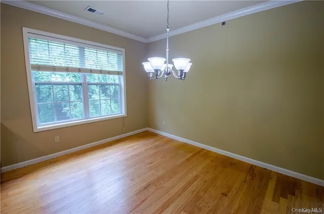a view of a kitchen with a stove cabinets and wooden floor