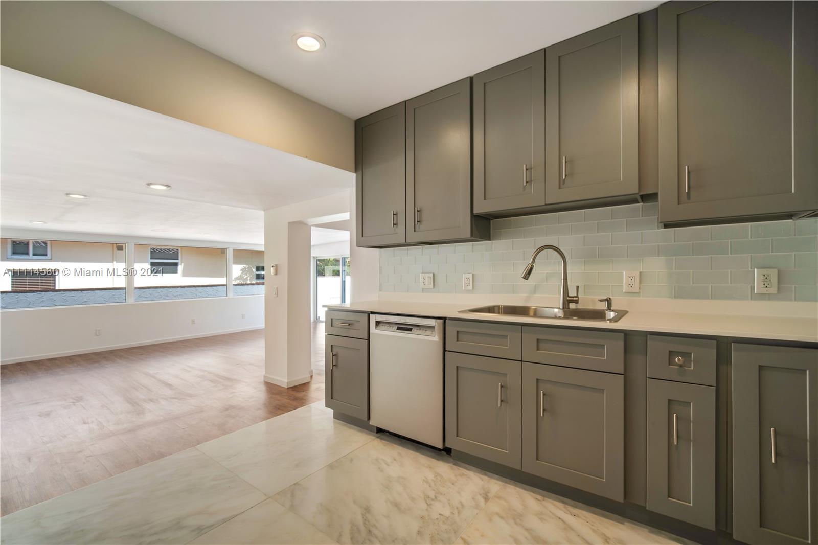 825 Southwest 28th Road Miami, FL 33129 - Photo 15 of 40 a kitchen with sink and cabinets