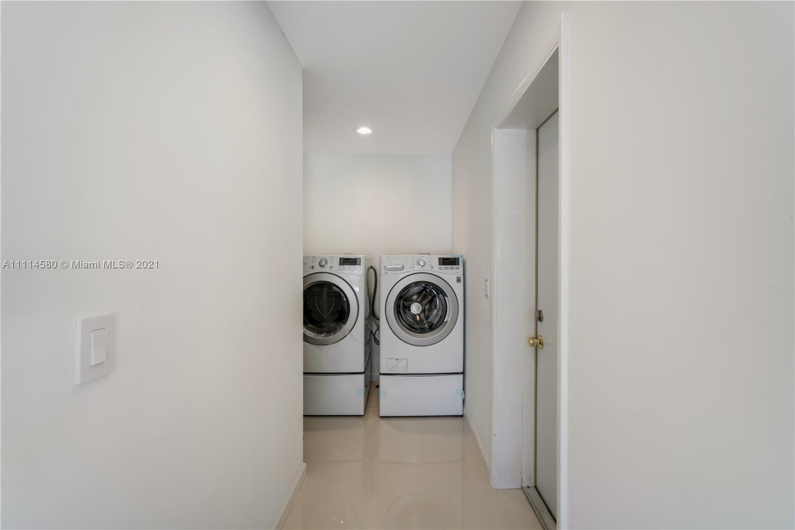 825 Southwest 28th Road Miami, FL 33129 - Photo 16 of 40 a utility room with dryer and washer