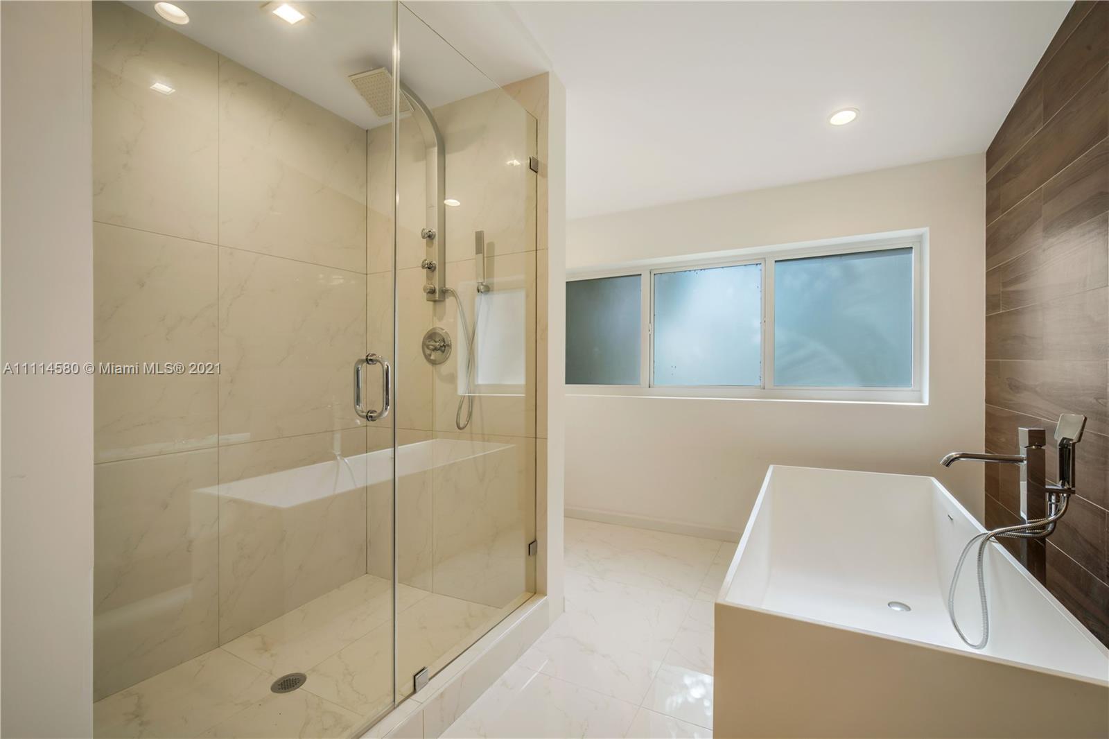 825 Southwest 28th Road Miami, FL 33129 - Photo 18 of 40 a bathroom with a bathtub and a sink