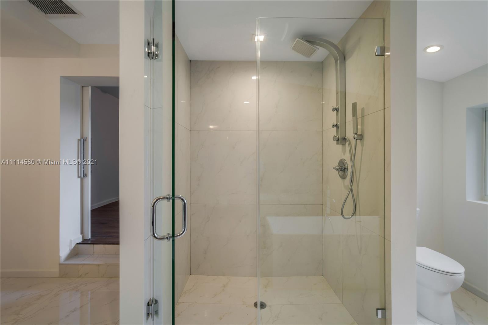 825 Southwest 28th Road Miami, FL 33129 - Photo 31 of 40 a bathroom with a shower and a toilet