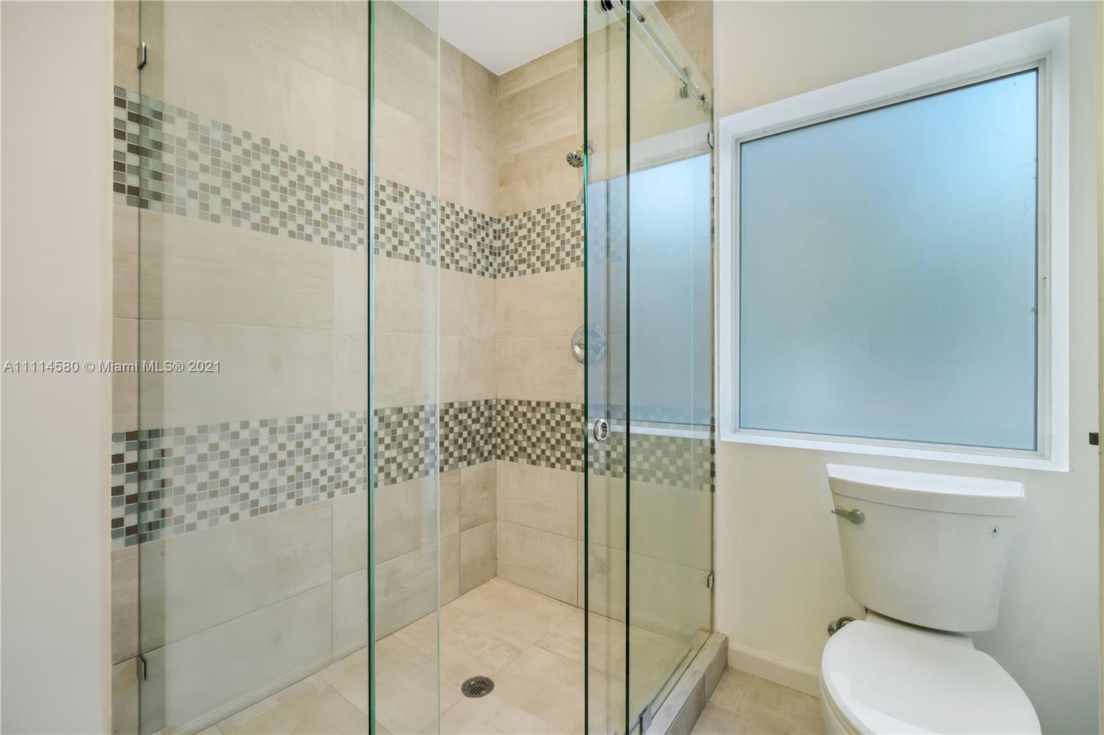 825 Southwest 28th Road Miami, FL 33129 - Photo 32 of 40 a bathroom with a shower and toilet