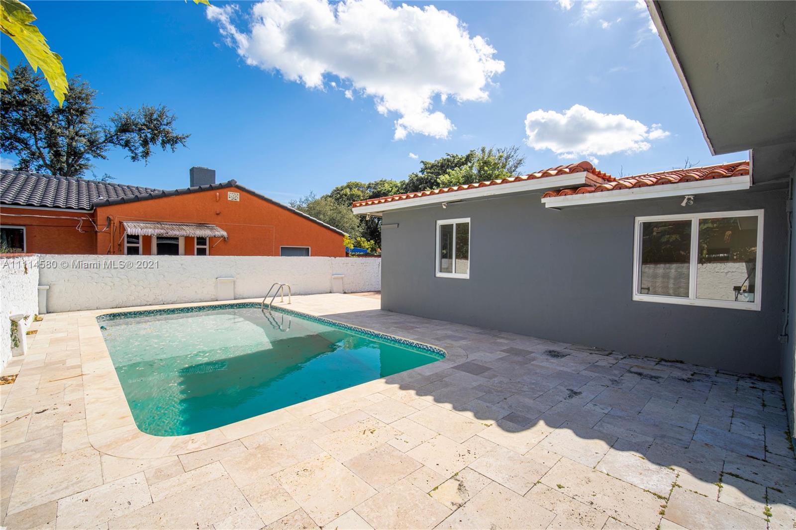 825 Southwest 28th Road Miami, FL 33129 - Photo 35 of 40 a view of an white house with a yard