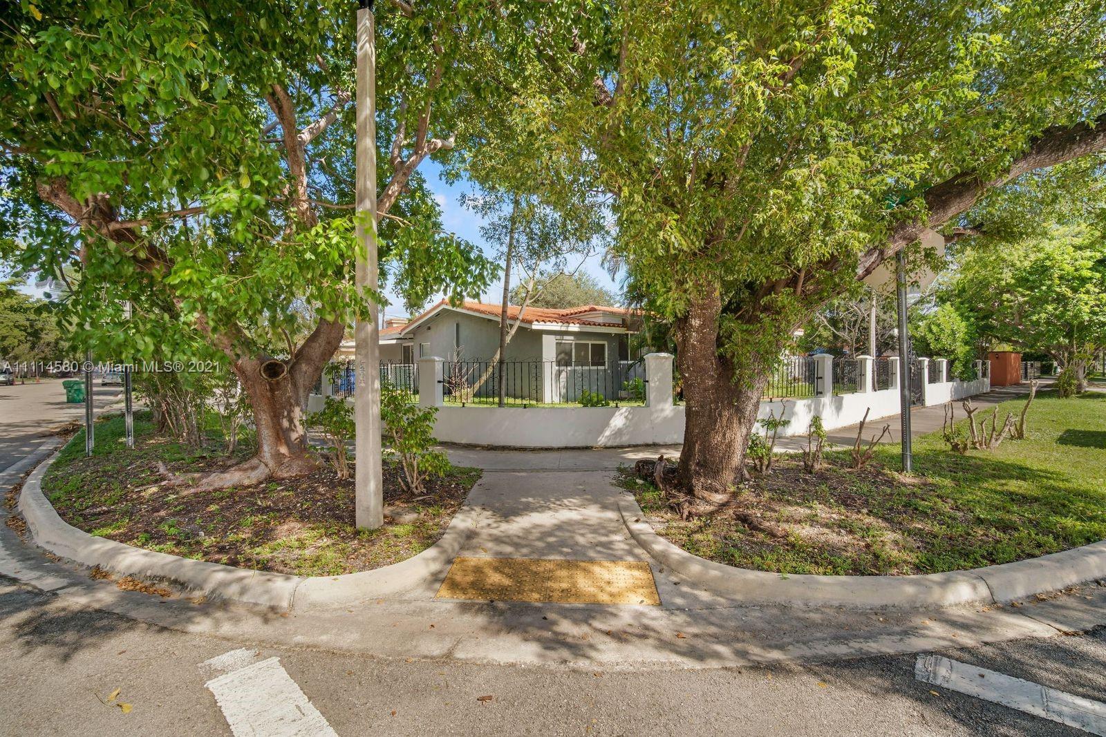 825 Southwest 28th Road Miami, FL 33129 - Photo 6 of 40 a front view of a house with a yard