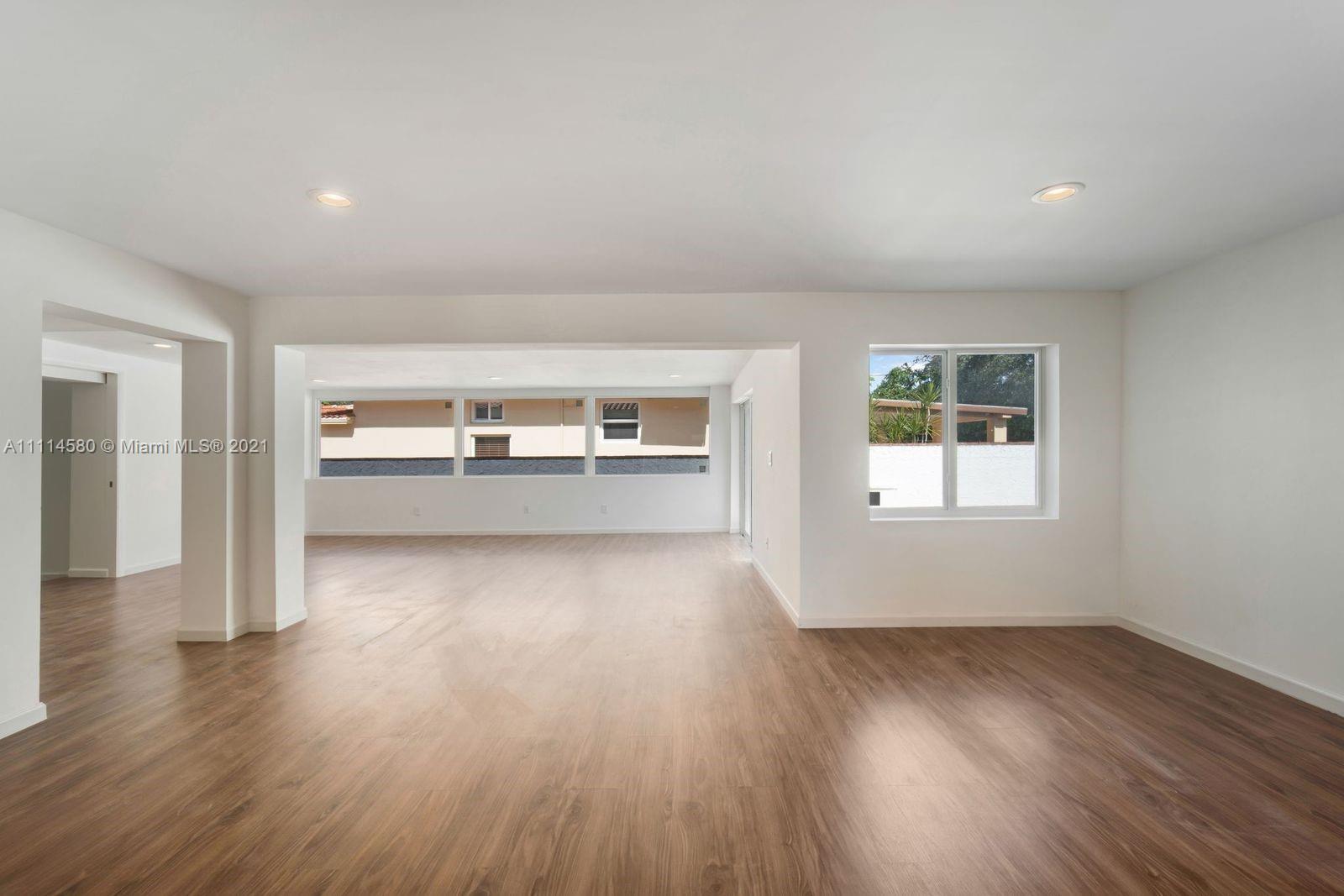 825 Southwest 28th Road Miami, FL 33129 - Photo 9 of 40 wooden floor in an empty room with a window