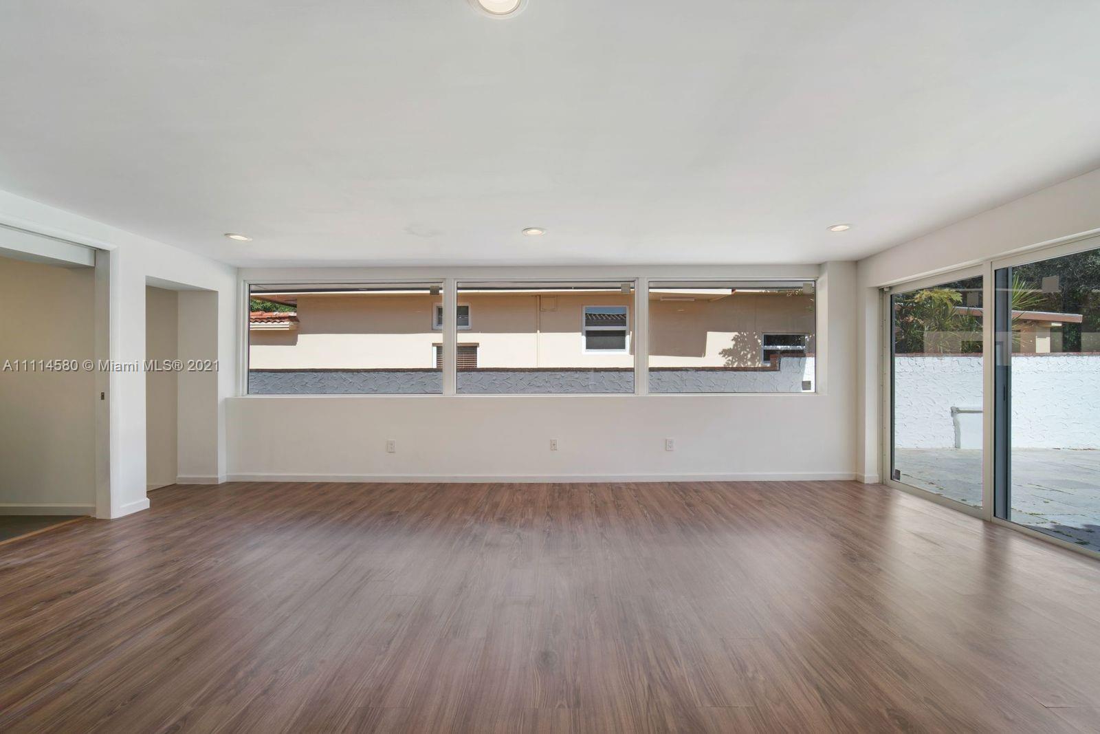 825 Southwest 28th Road Miami, FL 33129 - Photo 10 of 40 a view of a kitchen with wooden floor and a sink
