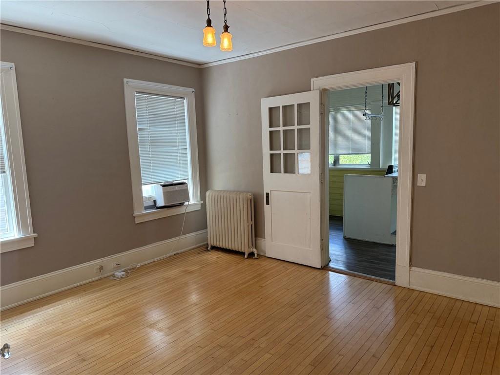 846 Briarcliff Road Northeast Atlanta, GA 30306 - Photo 8 of 22 an empty room with wooden floor and windows