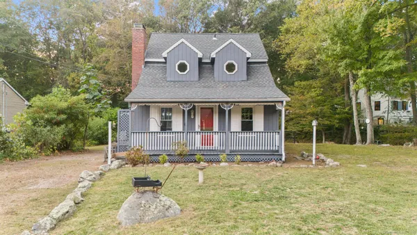 a house with trees in the background