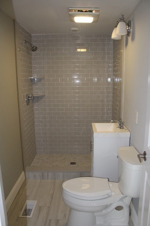 81 Alder Street Waltham, MA 02453 - Photo 16 of 38 a bathroom with a toilet and a shower
